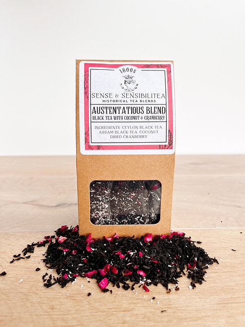 Austentatious tea blend package surrounded by leaves