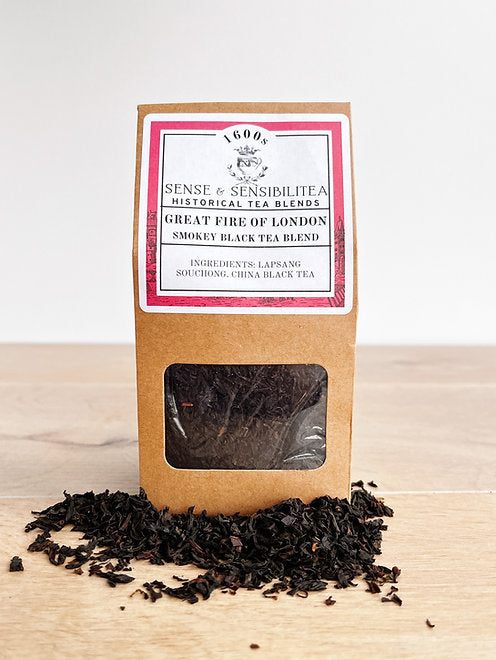 The Great Fire of London Tea package with tea leaves decorated around it