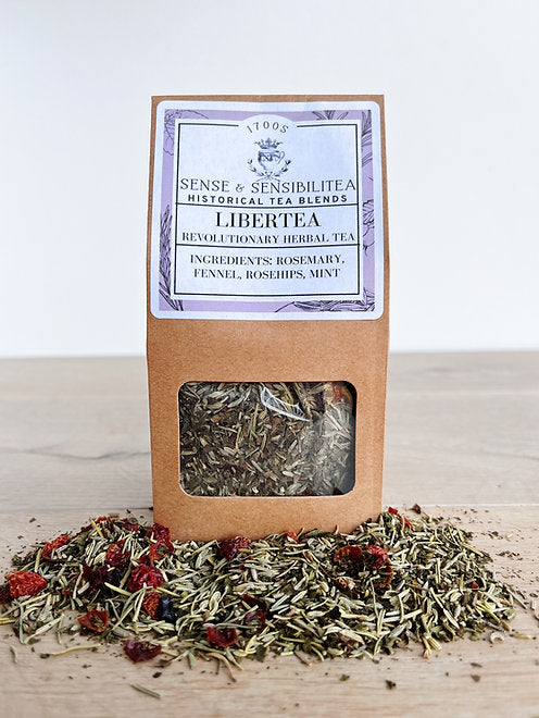 Libertea tea blend package surrounded by leaves