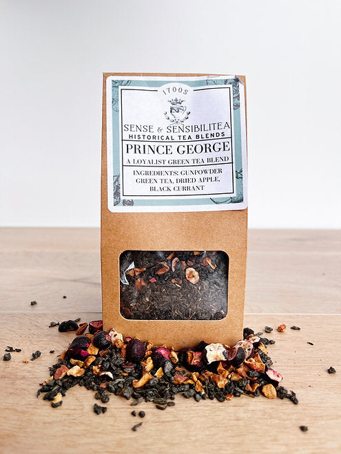 Prince George Tea Package surrounded by leaves