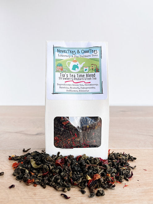 Tia's Tea Time package surrounded by loose tea leaves