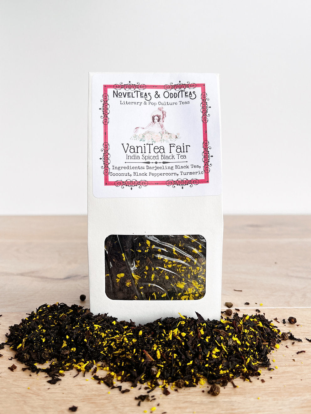 VaniTeaFair tea package surrounded by loose tea leaves